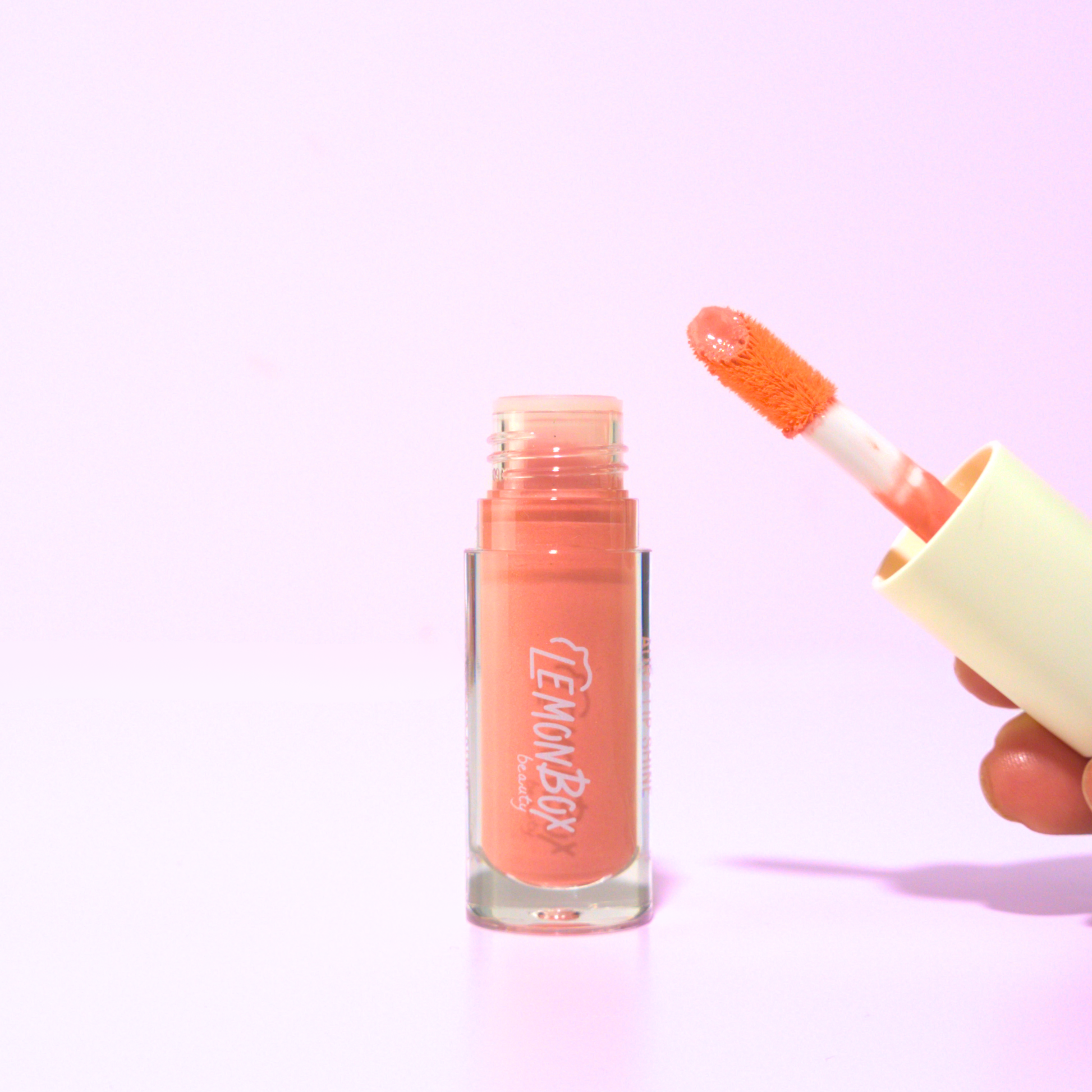 Aura Lip Shine Lip Gloss  Lemon Box Beauty product photo FUZZ