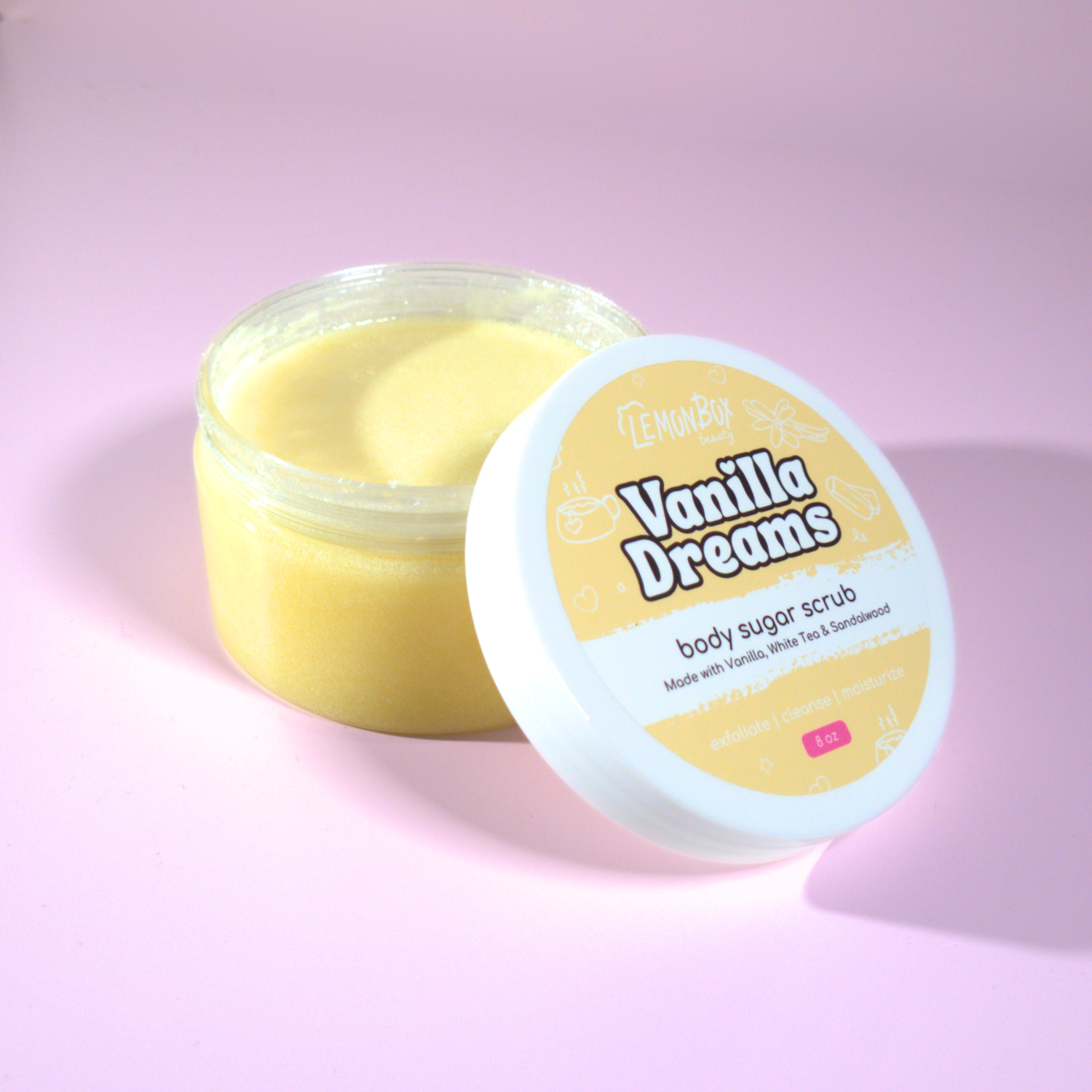 Jar of Vanilla Dreams body sugar scrub on a pink background