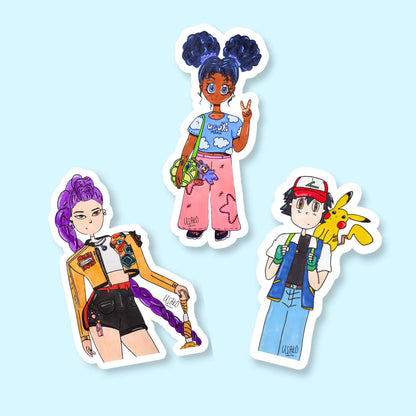 Three colorful stickers of Black girl anime, Rumi from K Pop Demon Hunters and Ash Ketchum from Pokémon on a light blue background