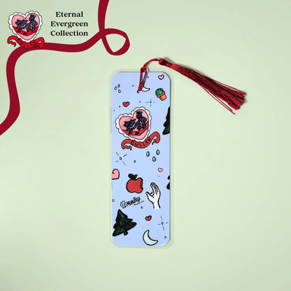 Decorative bookmark with illustrations and a red tassel on a light green background, featuring the 'Eternal Evergreen Collection' branding.