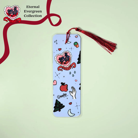 Decorative bookmark with illustrations and a red tassel on a light green background, featuring the 'Eternal Evergreen Collection' branding.