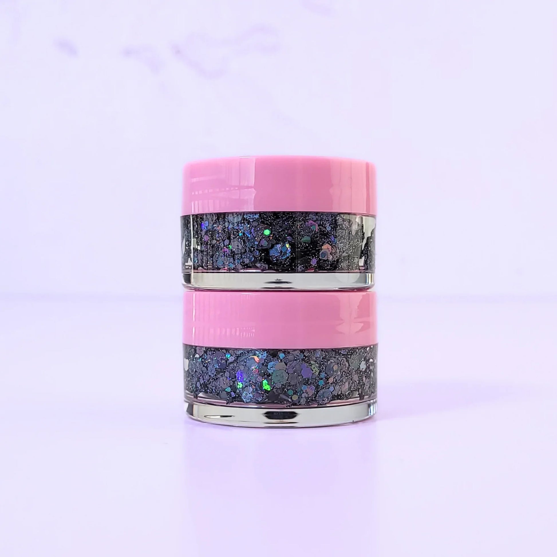 Lemon Box Beauty Disco Dream Glitter Jelli - holographic black and multi-colored chunky body glitter in a clear jar with a texture swatch on a pink spatula.