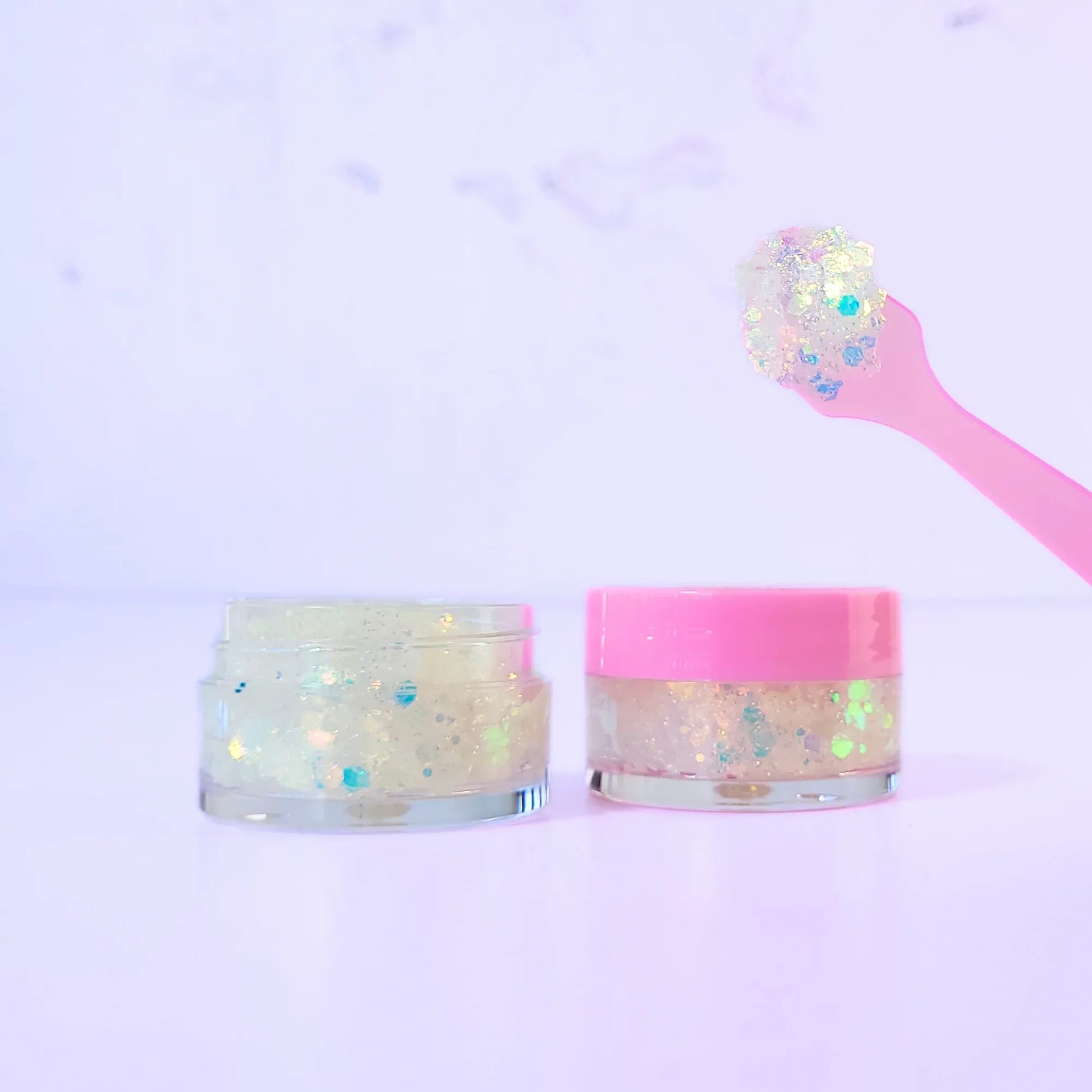 Lemon Box Beauty Frosted Glitter Jelli - iridescent white and silver chunky body glitter in a clear jar with a texture swatch on a pink spatula.