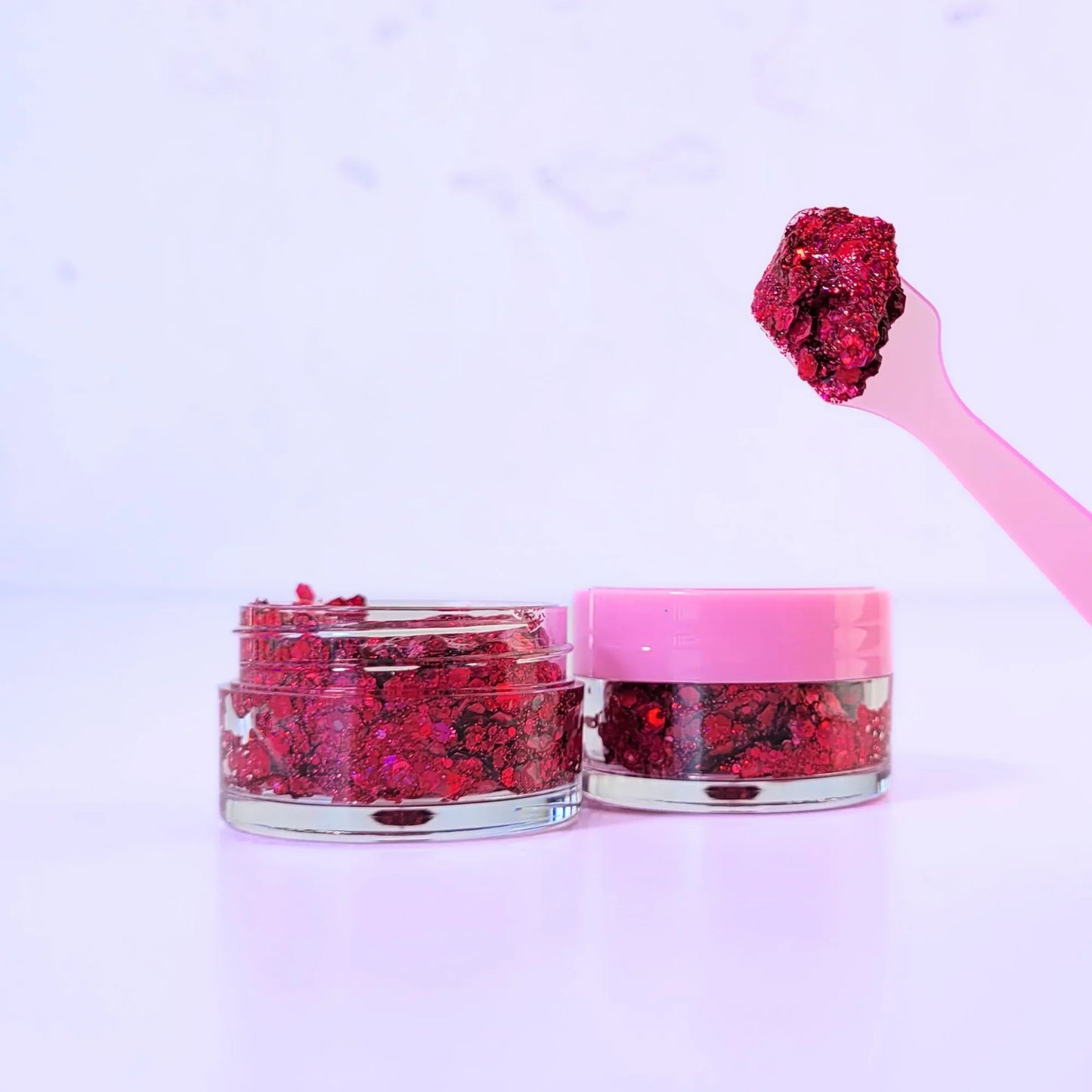 Lemon Box Beauty Jellyheart Glitter Jelli - vibrant ruby red chunky body glitter in a clear jar with a texture swatch on a pink spatula.