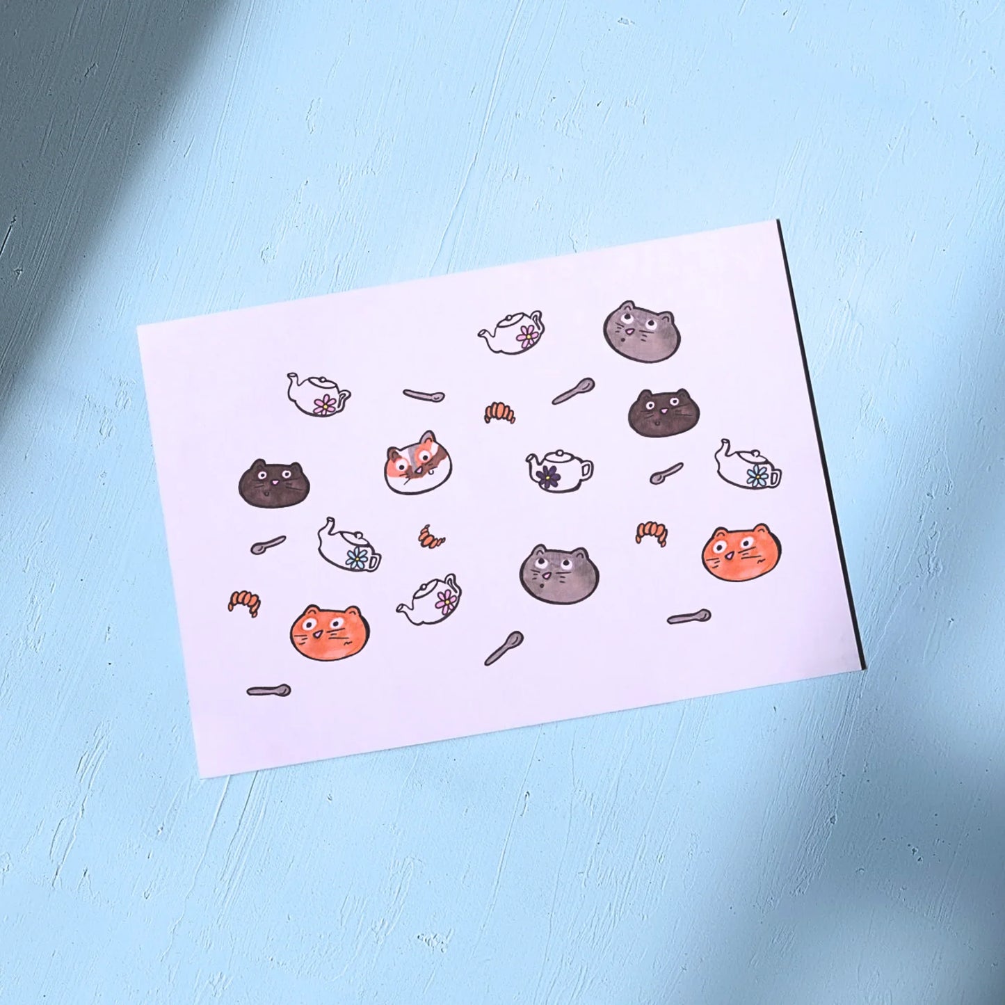 White Greeting Card with Cat Themed design on a light blue background