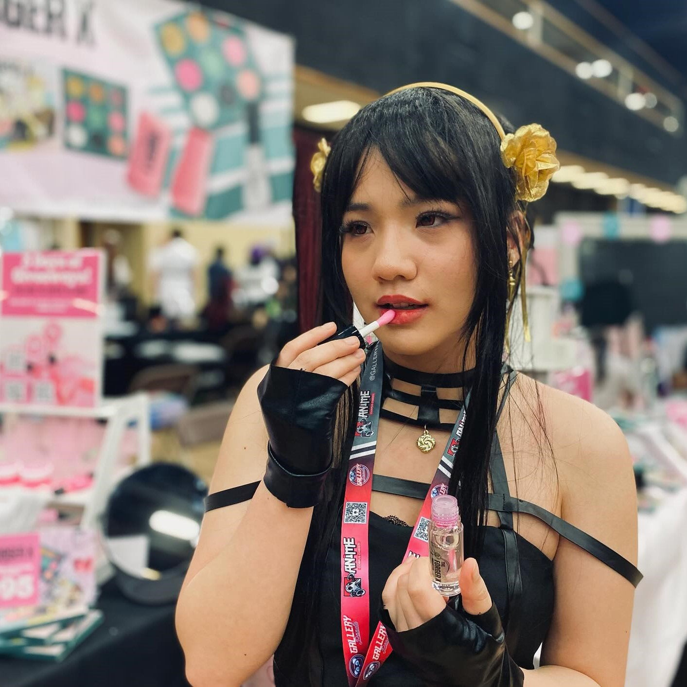 Woman applying lipstick in a store setting the thorn princess