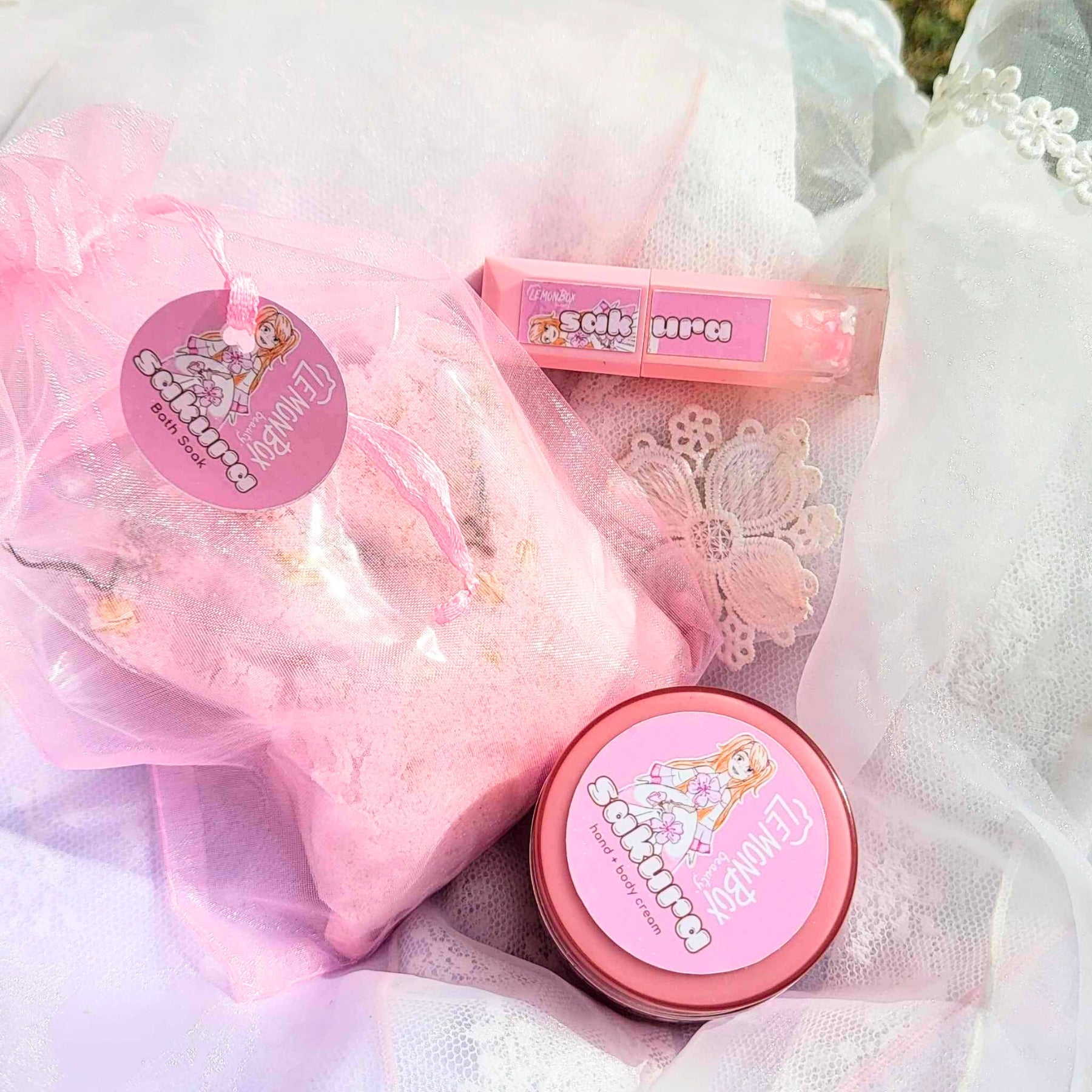 Pink bath bomb with packaging on a light fabric background Sakura Cherry blossom