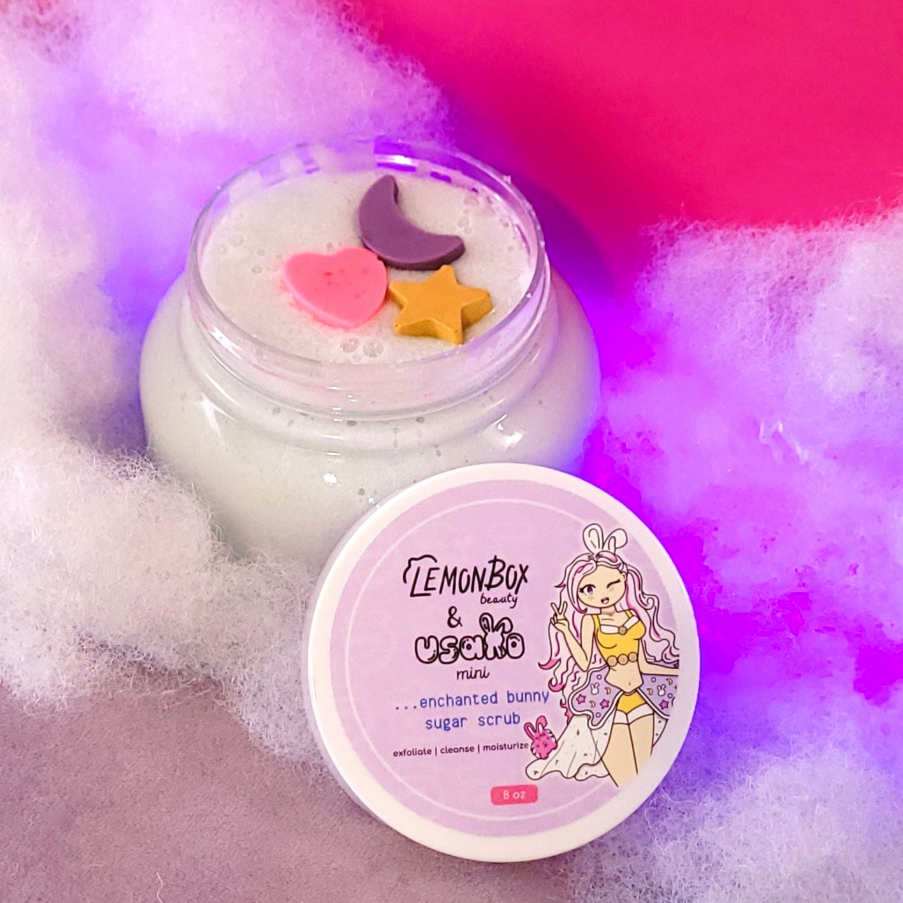 LemonBox beauty & co. mini Enchanted Bunny Sugar Scrub with colorful lid on a textured background