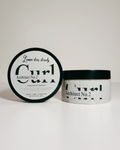 A jar of Architect No. 2 curl cream with its lid placed beside it on a clean white background.