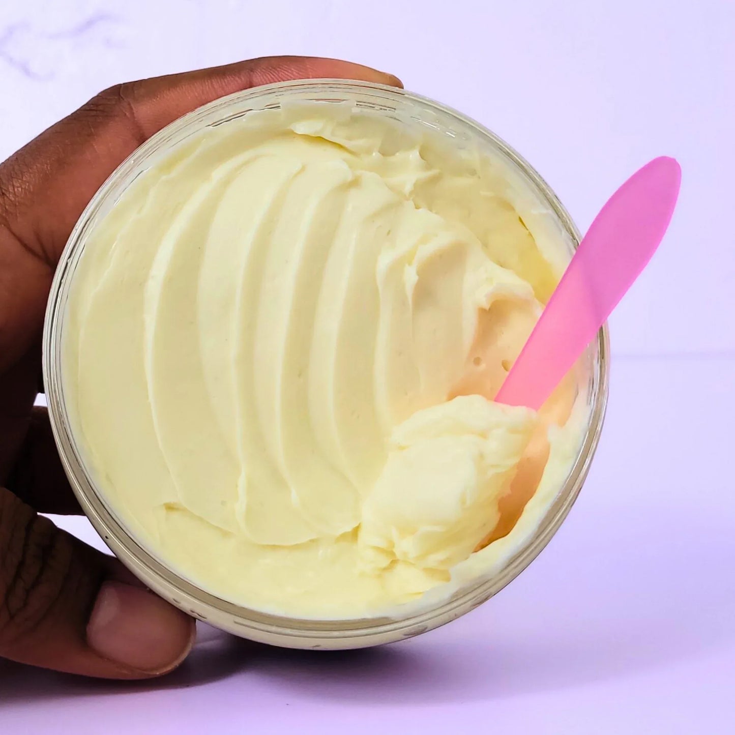 Two 8.5 oz jars of LemonBox Beauty Curling Cream close up texture shot of Mango Butter formula (Types 2A-3B) and the bottom is the Shea Butter formula (Types 3C-4C), set against a lavender background.