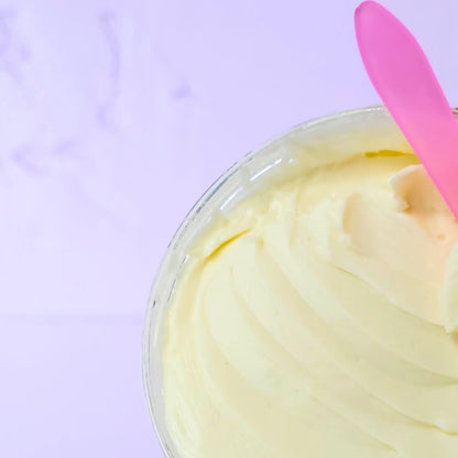 Two 8.5 oz jars of LemonBox Beauty Curling Cream Close up texture shot of Mango Butter formula (Types 2A-3B) and the bottom is the Shea Butter formula (Types 3C-4C), set against a lavender background.