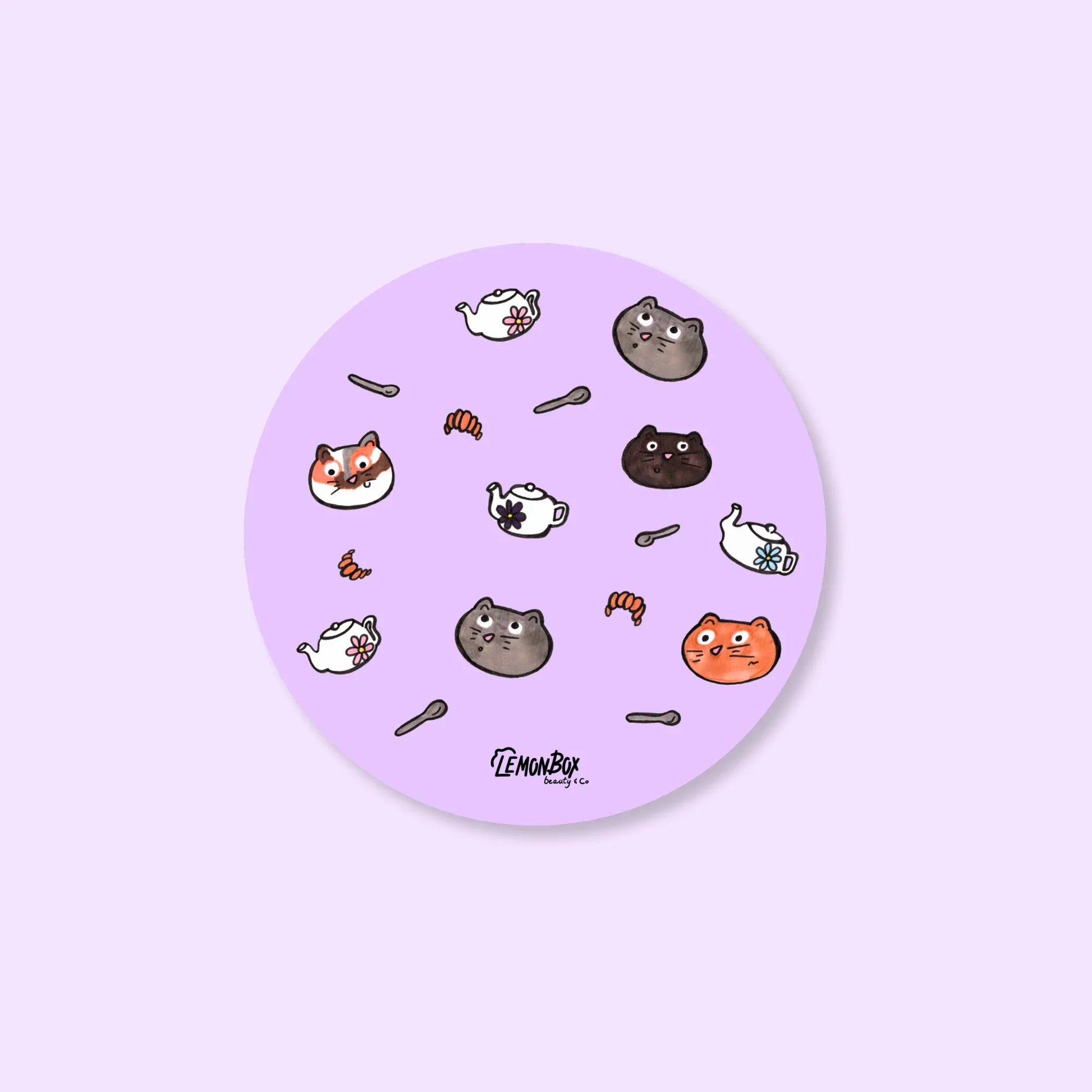 Round purple sticker with cartoon cat illustrations on a light purple background