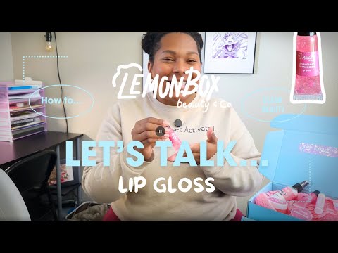 Rochelle Lowery holding the Strawberry Lemonade Lip GLoss Showcasing its Contents