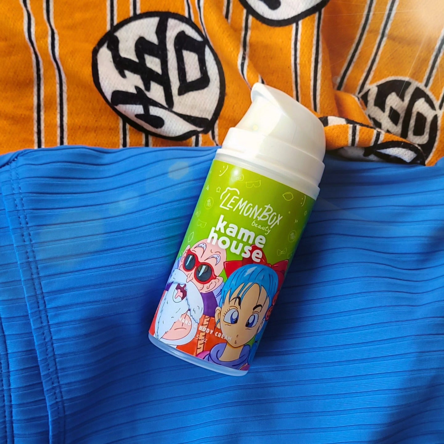 Lemon Box Kame House product on a blue surface with an orange and black patterned fabric in the background