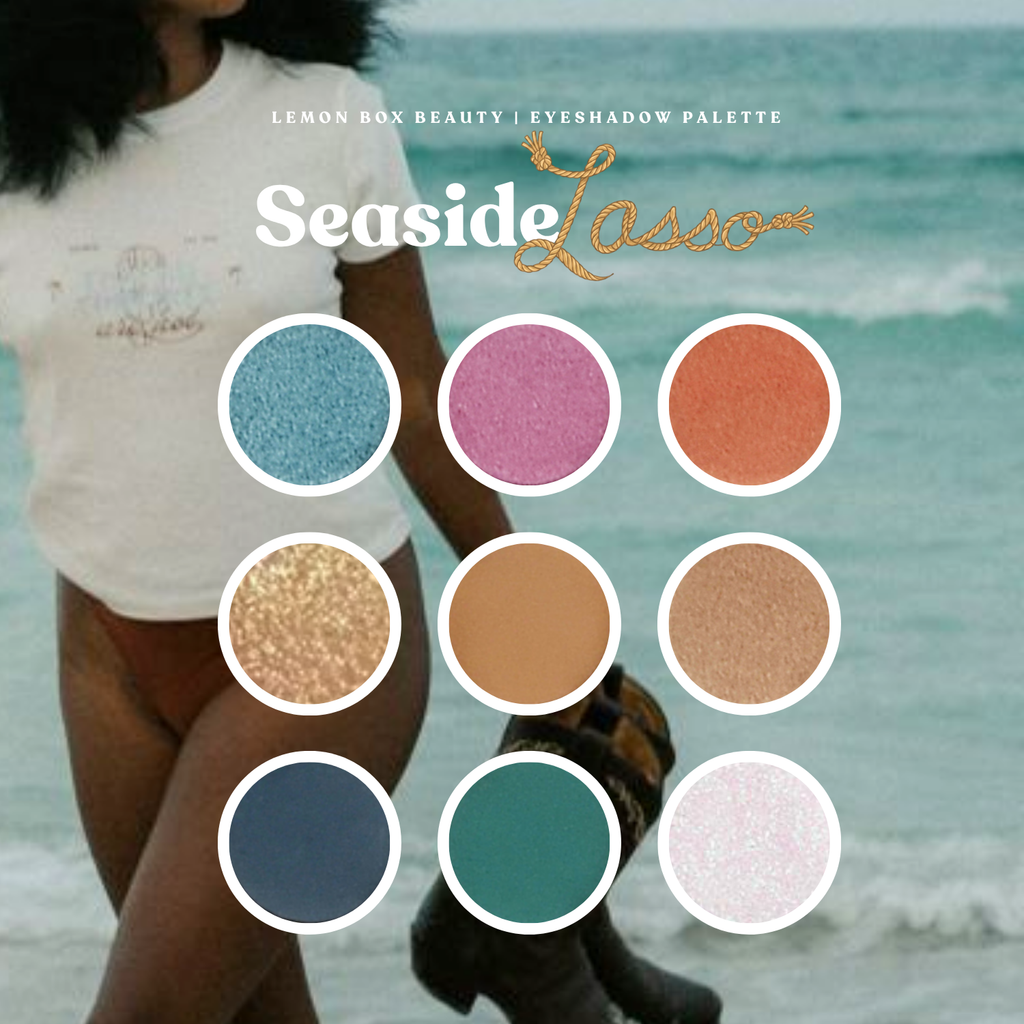 Lemon Box Beauty Seaside Lasso eyeshadow palette with color swatches and a blurred beach background
